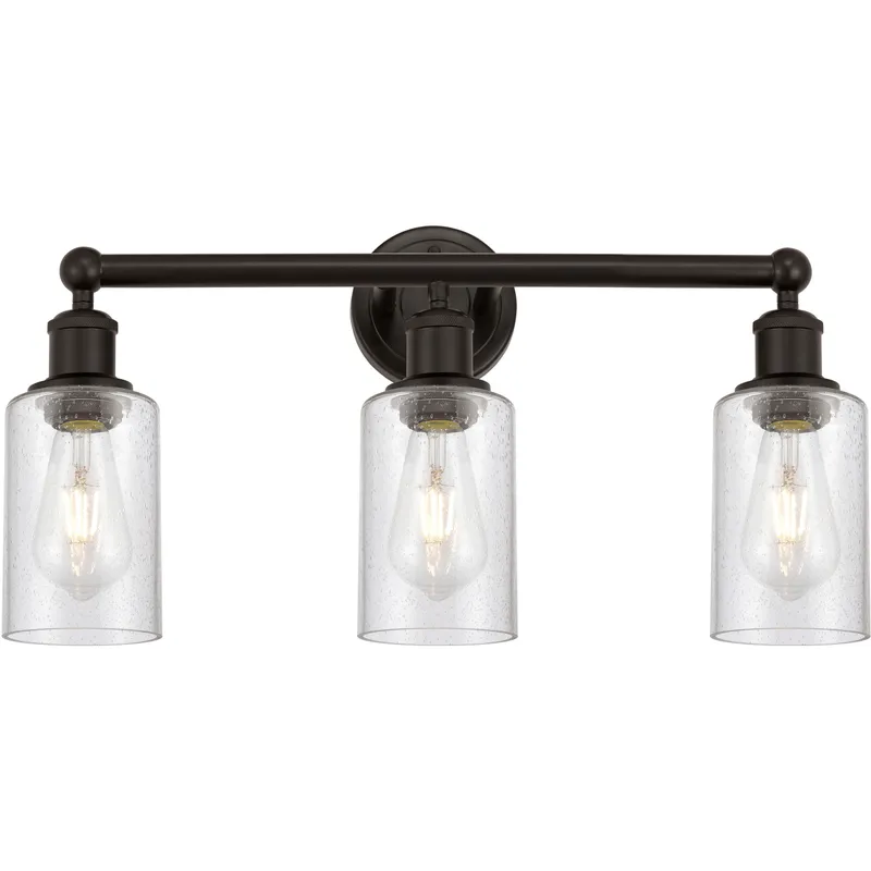 Clymer 3 Light 21.88 inch Oil Rubbed Bronze Bath Vanity Light Wall Light in Seedy Glass
