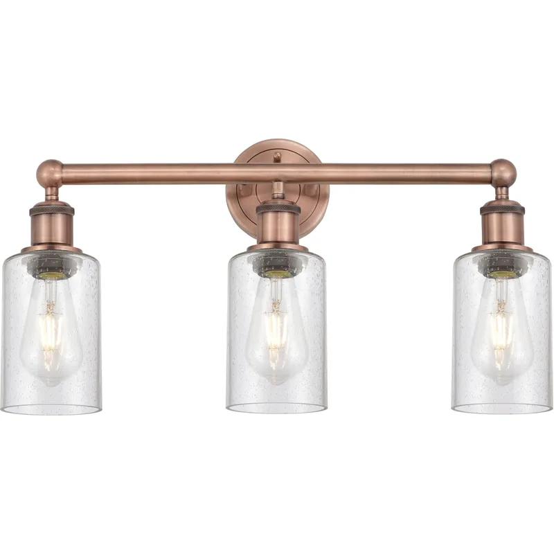 Clymer 3 Light 21.88 inch Antique Copper Bath Vanity Light Wall Light in Seedy Glass