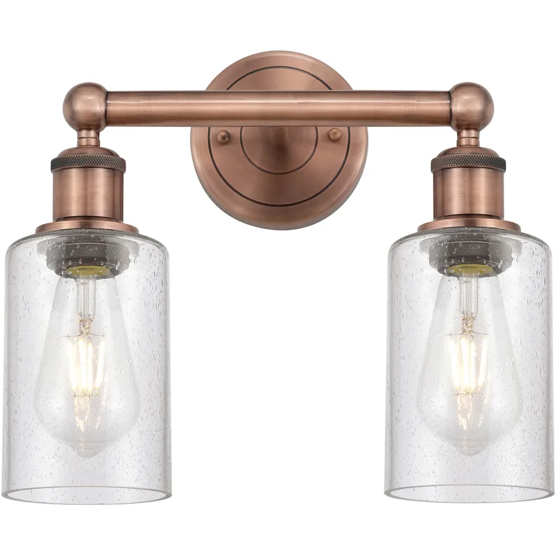 Clymer 2 Light 12.88 inch Antique Copper Bath Vanity Light Wall Light in Seedy Glass