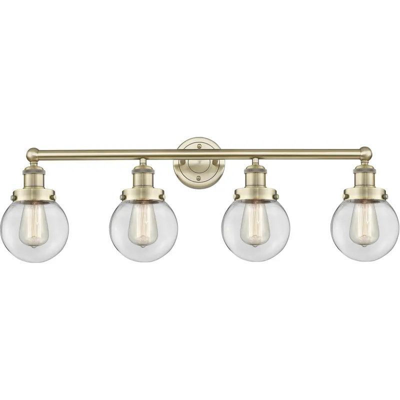 Beacon 4 Light 33.5 inch Antique Brass Bath Vanity Light Wall Light in Clear