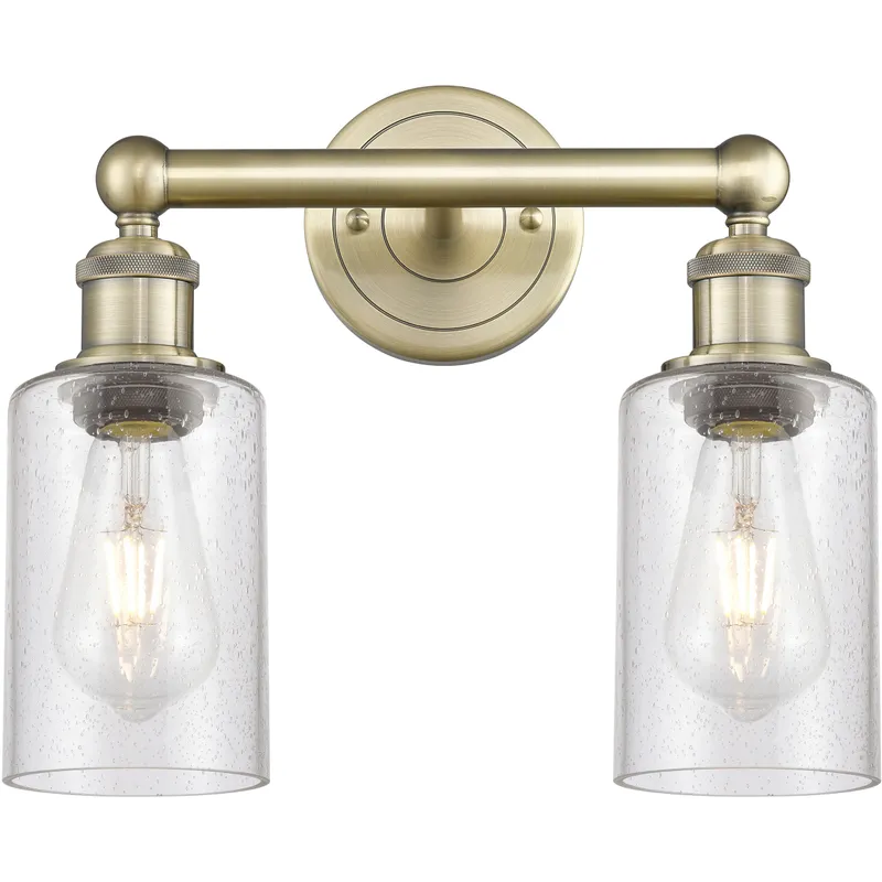 Clymer 2 Light 12.88 inch Antique Brass Bath Vanity Light Wall Light in Seedy Glass