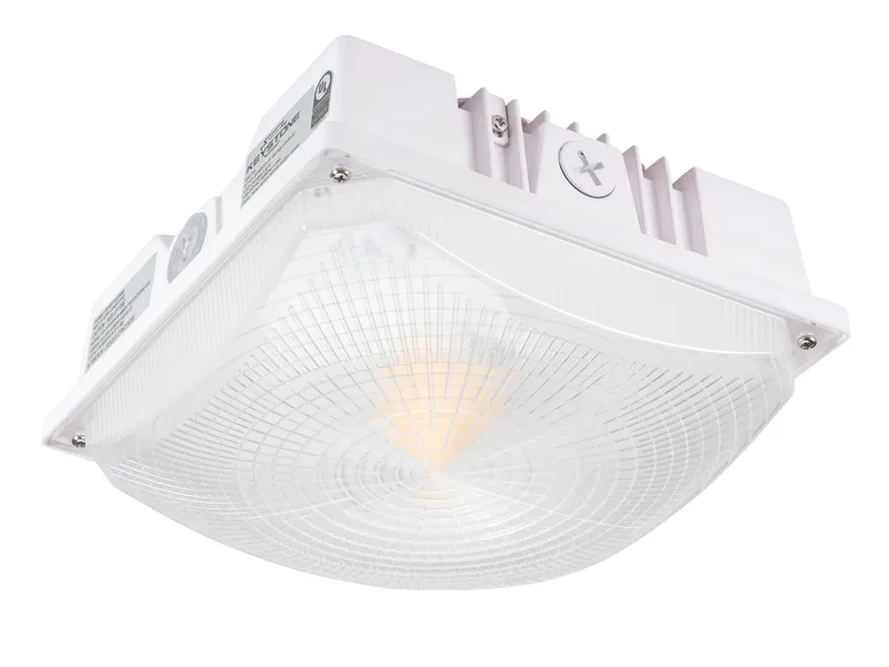 60/50/40W Power Select LED Canopy. Color Select 3000/4000/5000K. Built in Photocell. Microwave Sensor Receptacle. 10" Square Housing. 120-277V Input. 160° Beam Angle. White.
