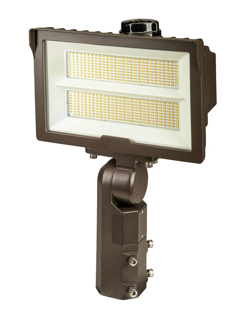 140W LED Flood Light feat. Power Select, Color Select. Rectangular Series 2 with Built-in Photocell. 120-277V Input, 3000K/4000K/5000K. Standard Bronze Housing. 7H x 6V Distribution, Slip Fitter and Trunnion Mount Included. TAA Compliant